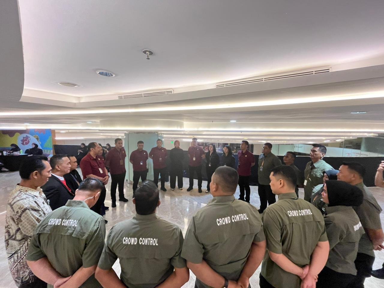 BRL crowd control team huddle briefing inside the venue